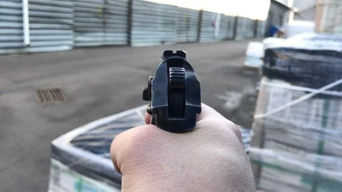 Man with a gun looking for a target Stock-Footage 104825893