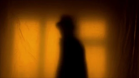 Man with a gun in silhouette Stock Footage
