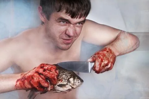Man guts fish Stock Photos