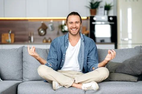 Man guy freelancer stylish caucasian meditation lotus position harmony Stock Photos