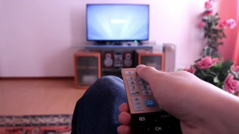 Man Guy Person Hand Right Operating Turning on TV Remote Screen Pushing Button Stock Footage 306463709