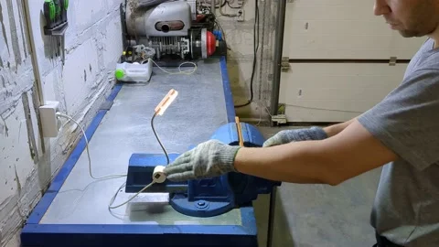 Man guy processes and cuts metal Stock Footage 232570149