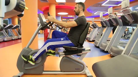 Man on gym bycicles Stock Footage 46591903