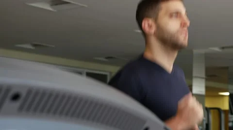 Man at the gym doing exercise on the treadmill Stock Footage 65818829