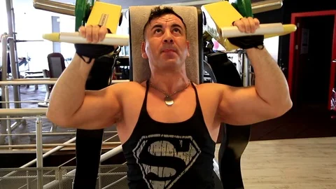 Man in gym doing press push weight exercise Stock Footage 75992054