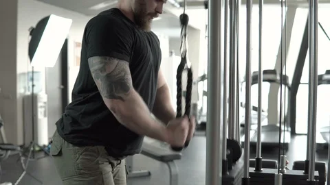 Man in gym doing pulls weight exercise close-up 4k. Stock Footage 85715721