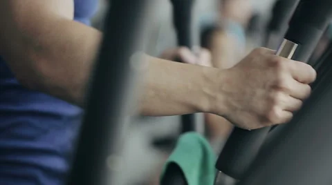 Man at the gym exercising on the trainer machine Stock Footage 52090242