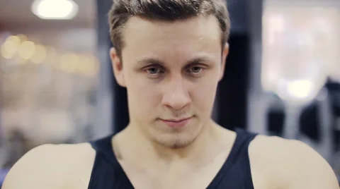 Man in gym on machine exercising close-up  slow motion Stock Footage 58517193