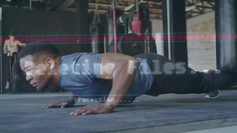 Man in gym starting plank doing pushups for fitness while glitch overlay showing Stock Footage 331571223