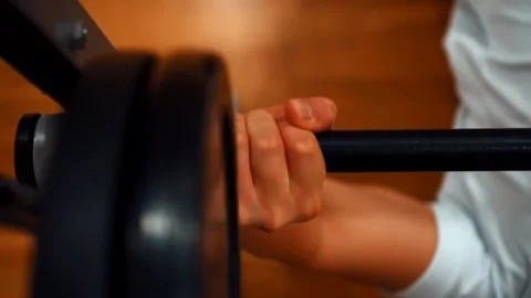 Man in the gym training with a barbell Stock Footage 142375307
