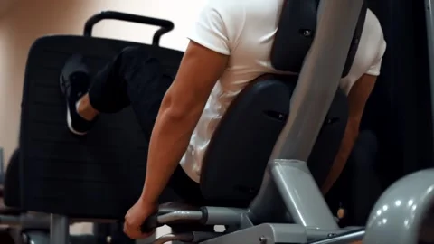Man in the gym training legs Stock Footage 142375283
