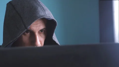 Man hacker in the hood concept. unknown hacker criminal breaks into lifestyle 動画素材 102981398