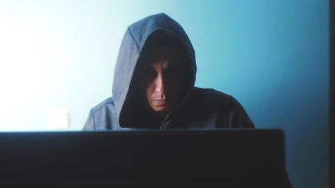 Man hacker in the hood concept. unknown hacker criminal breaks into computer 動画素材 103751925
