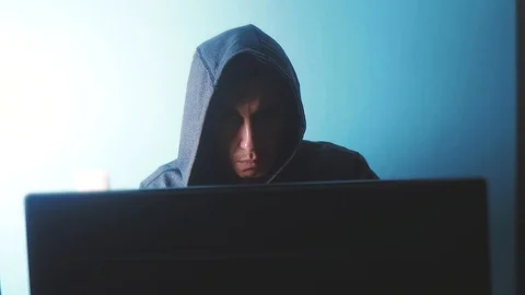 Man hacker in the hood concept. unknown hacker criminal breaks into computer 動画素材 104554589