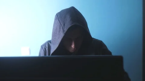 Man hacker in the hood concept. unknown hacker criminal breaks into computer 動画素材 104929475