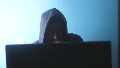 Man hacker in the hood concept. unknown hacker criminal breaks into computer 動画素材 107740543