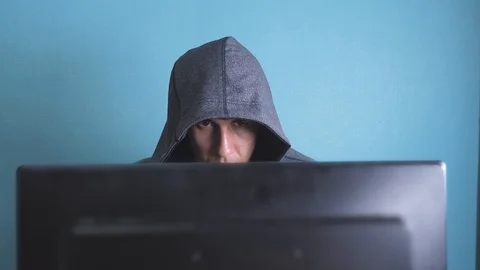 Man hacker in the hood hacking network concept. unknown hacker criminal breaks 動画素材 102861743