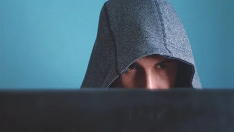 Man hacker in the hood hacking network concept. unknown hacker criminal breaks 動画素材 102964836