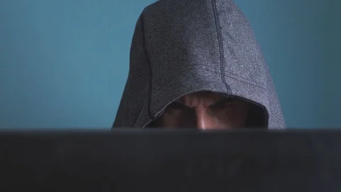 Man hacker in the hood hacking network concept. unknown hacker criminal breaks 動画素材 103941352