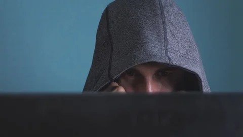 Man hacker in the hood hacking network concept. unknown hacker criminal breaks 動画素材 104930830