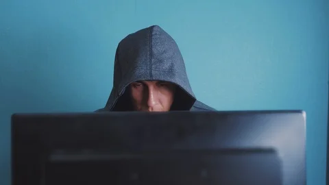 Man hacker in the hood hacking network concept. unknown hacker criminal breaks Stock Footage 104931155