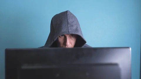 Man hacker in the hood hacking network concept. unknown hacker criminal breaks 動画素材 105020978