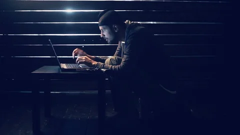 Man the hacker works behind the computer Stock Footage 88436796