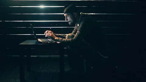 Man the hacker works behind the computer Vidéo 88612678