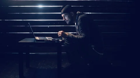 Man the hacker works behind the computer Видео 88728779