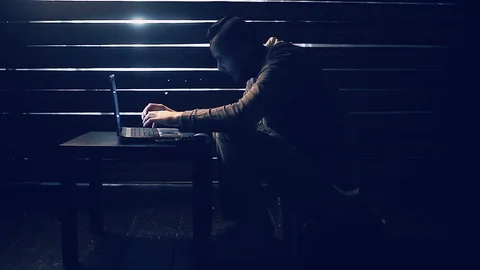 Man the hacker works behind the computer Stock Footage 88728954