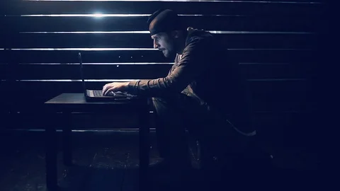 Man the hacker works behind the computer Stock-Footage 90103616
