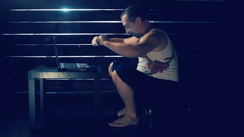 Man the hacker works behind the computer Video stock 94793836