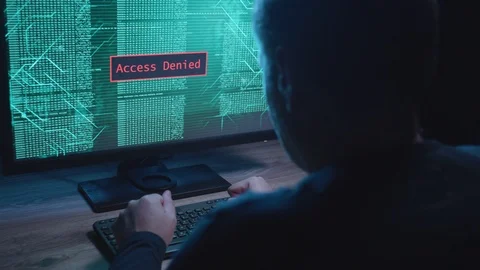 Man Hacking a Computer At Night Stock Footage 125098403