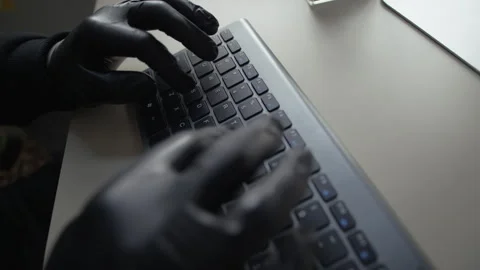 Man Hacking into Computer Trying to Steal Confidential Data from Office Stock Footage 313548843