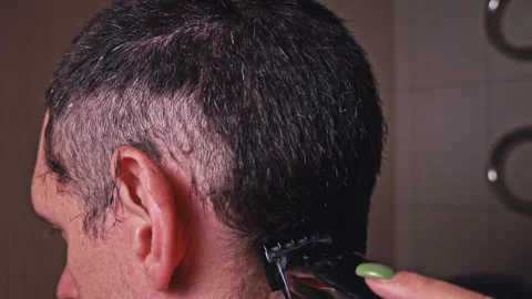 Man Haircut with Clipper Back View in Slow Mo Stock Footage 244972332