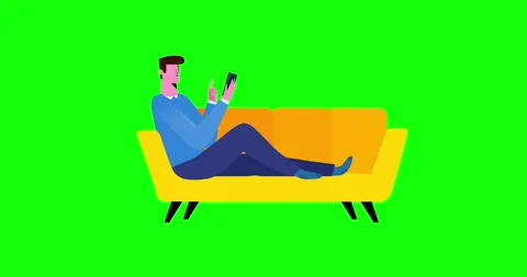 Man half sitting on sofa with phone on green screen Stock Footage 335672235