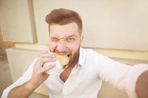 Man with hamburger Stock Photos