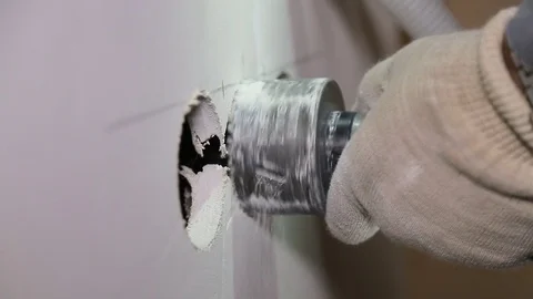 Man with Hammer drill doing hole for socket Stock Footage 71180569