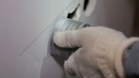 Man with Hammer drill doing hole for socket Stock Footage 71181348