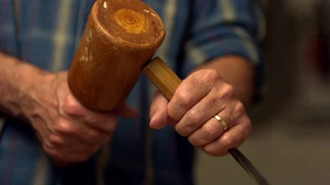 Man hammering the chisel in slow motion Video stock 81230375