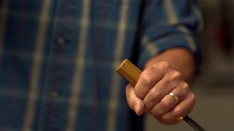 Man hammering the chisel in slow motion Stock Footage 81230376