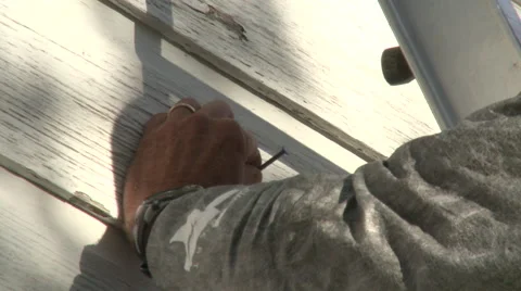 Man hammering nail Stock Footage 57690727