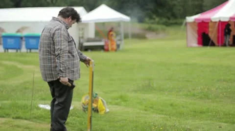 Man hammering pole Stock Footage 20540861