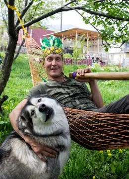 Man in a hammock with  pipe Stock Photos