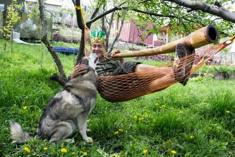 Man in a hammock with  pipe Stock Photos