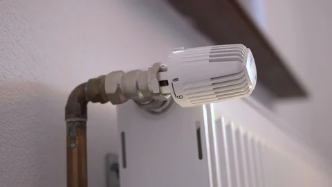 Man hand adjusting the room temperature Stock Footage 114655878