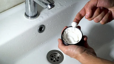 A man hand Apply Clay to  style hair - 2 times slow motion Stock Footage 129629570