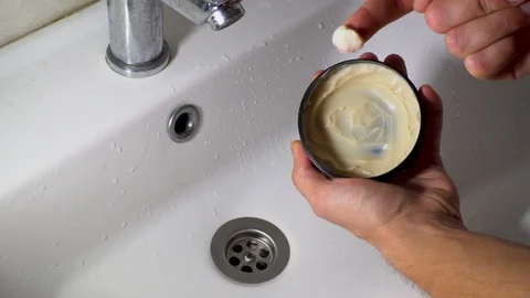 A man hand Apply Wax to  style hair Stock Footage 129635162