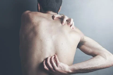 Man hand on back Stock Photos