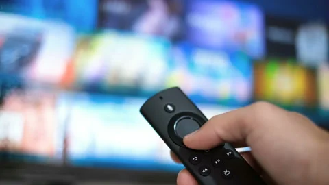 Man hand browsing smart tv apps,zapping channel,leisure lock down home lifestyle Stock Footage 143982319